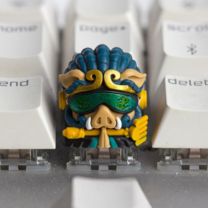Front view of Cyberpunk Pigsy Zhu Bajie artisan resin keycap with money-symbol green visor by Keycapper on a white mechanical keyboard.