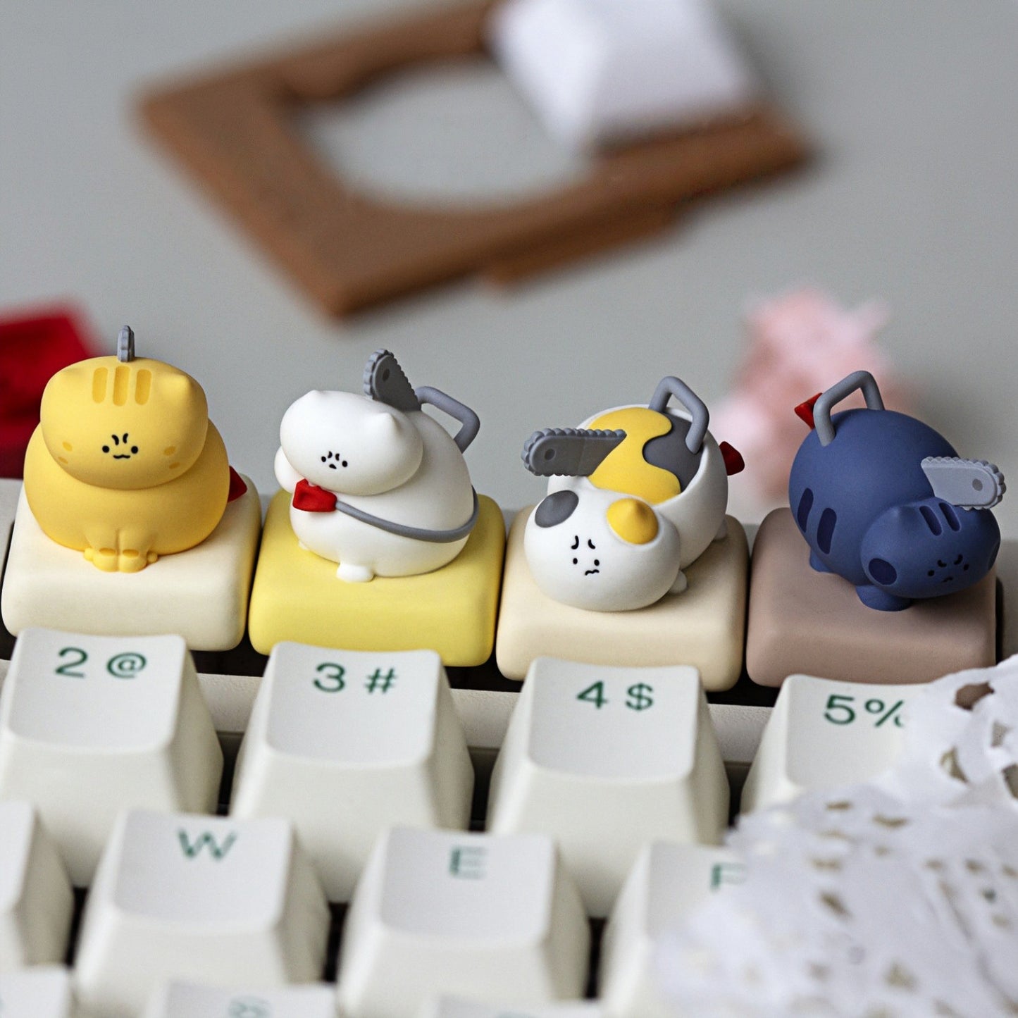 Keycapper Chainsaw Kitty Resin Artisan Keycaps collection line up on custom mechanical keyboard