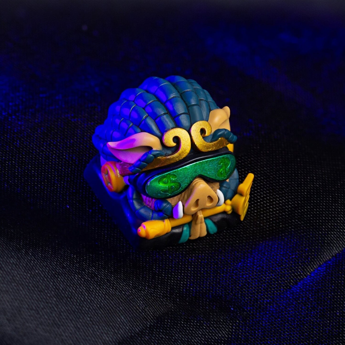 Macro detailed shot of Keycapper handmade Cyberpunk Zhu Bajie resin keycap featuring golden rake and cyber headset.