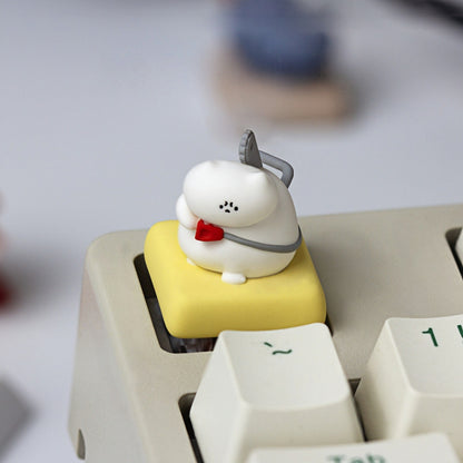 Keycapper Chainsaw Kitty white cat with red collar resin keycap top view