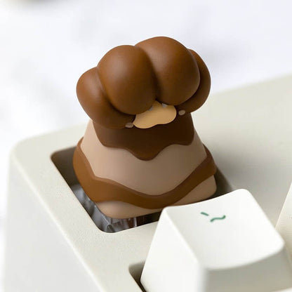 Keycapper brown bear paw resin artisan keycap with soft beige pads installed on a mechanical keyboard ESC row.