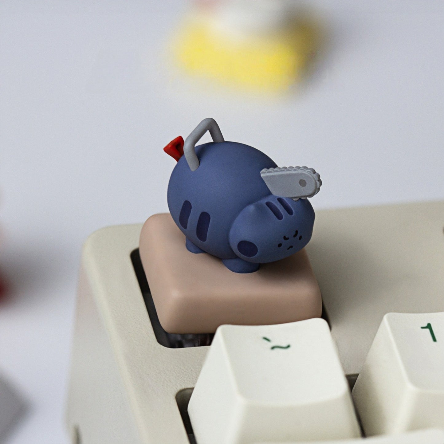 Keycapper Chainsaw Kitty dark blue purr-saw resin artisan keycap mounted on mechanical keyboard