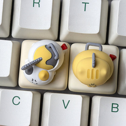 Top down view of Keycapper Chainsaw Kitty calico and yellow cat artisan keycaps