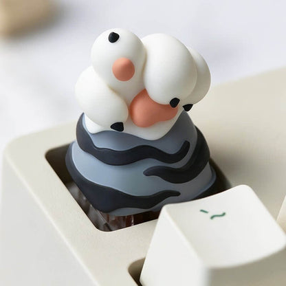 Keycapper white tiger paw resin artisan keycap with dark grey stripes and claws mounted on a mechanical keyboard.