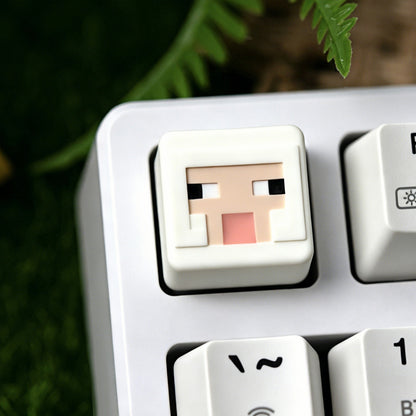 Keycapper™ Minecraft Cube Series Artisanal Keycap – A detailed view of a white 3D voxel Sheep mob head novelty keycap, with a textured woolly appearance, installed on the F1 key of a white mechanical keyboard.