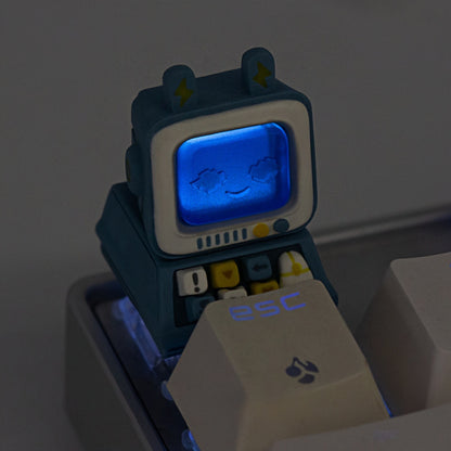 Keycapper blue retro computer artisan keycap with its screen brilliantly lit up in neon blue by the mechanical keyboard's under-glow.