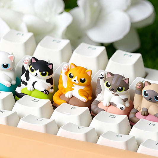 Side view of Keycapper cute kitten leg lift grooming resin artisan keycaps lined up on a custom mechanical keyboard.